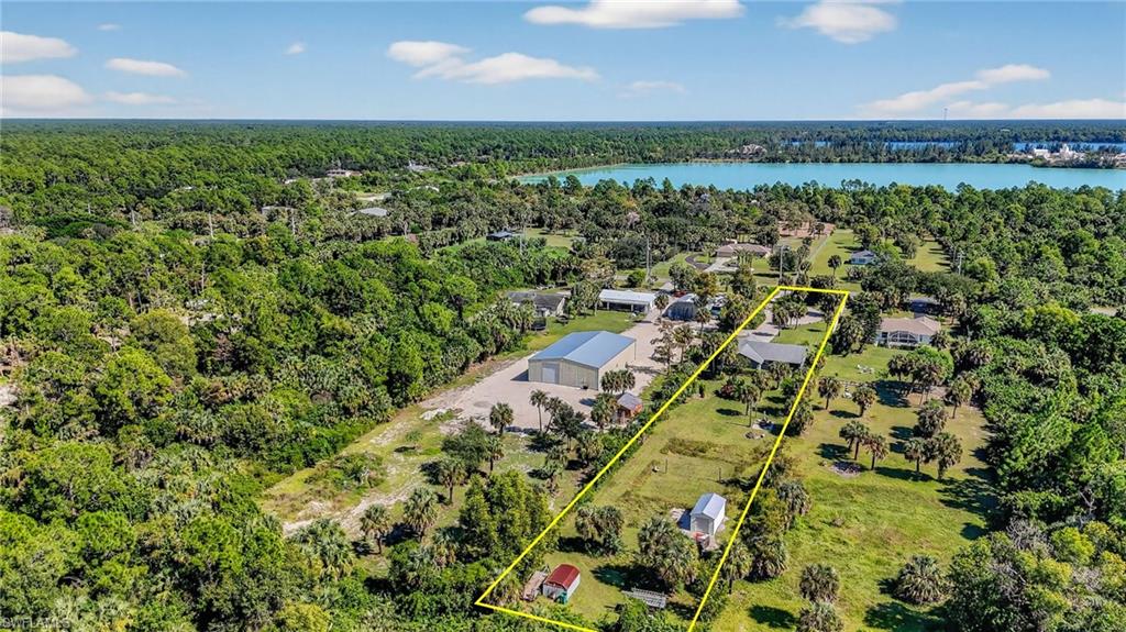 1081 9th Street Southwest Naples, FL 34117 - Photo 36 of 40 Aerial view of property's location featuring a nearby body of water and property parcel outlined