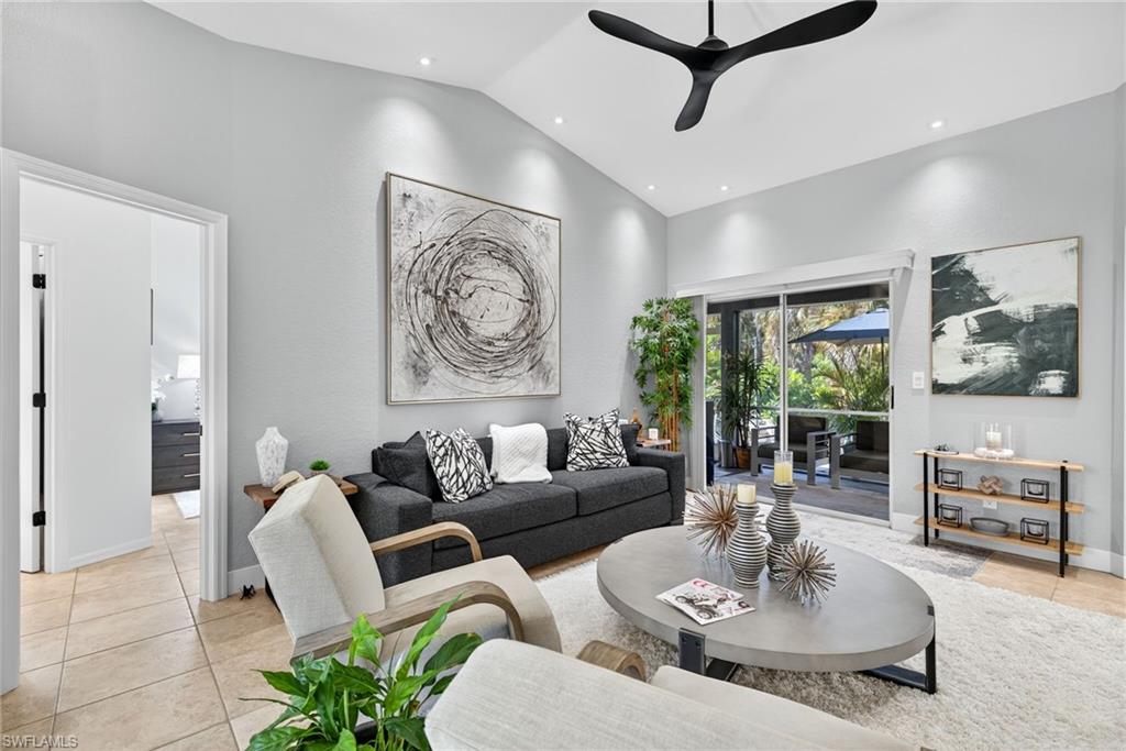 1081 9th Street Southwest Naples, FL 34117 - Photo 4 of 40 Living room featuring light tile patterned floors, a ceiling fan, recessed lighting, and high vaulted ceiling