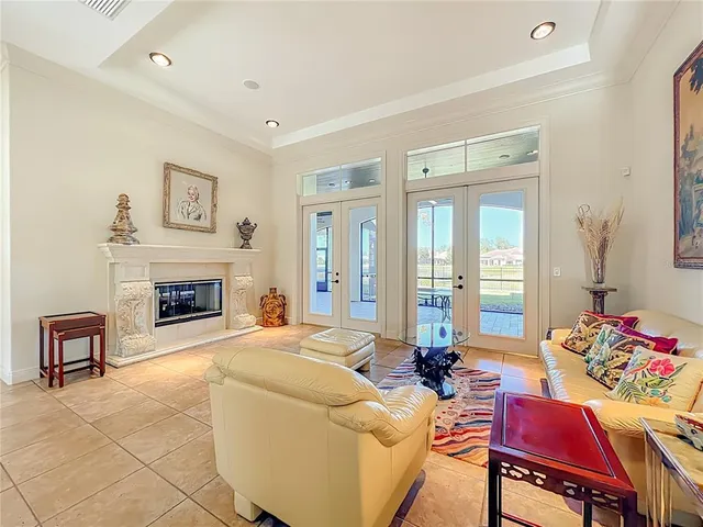 a spacious bathroom with a granite countertop sink a mirror and a shower