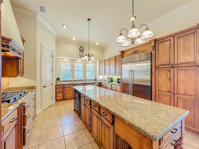 a utility room with granite countertop a washer and dryer