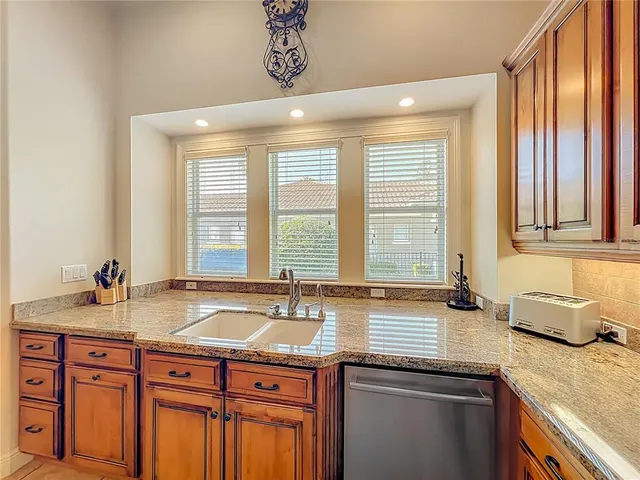 a view of a lake with houses in the background