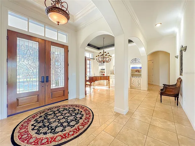 a living room with furniture a fireplace and a table