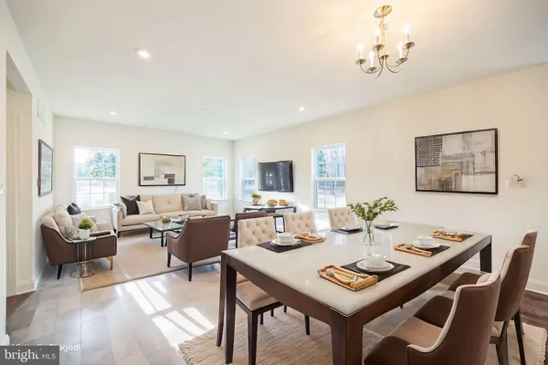 a view of a dining room with furniture and a livingroom