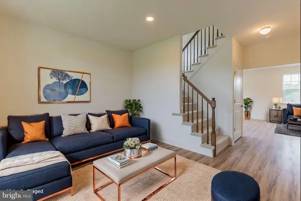 a living room with furniture and a table