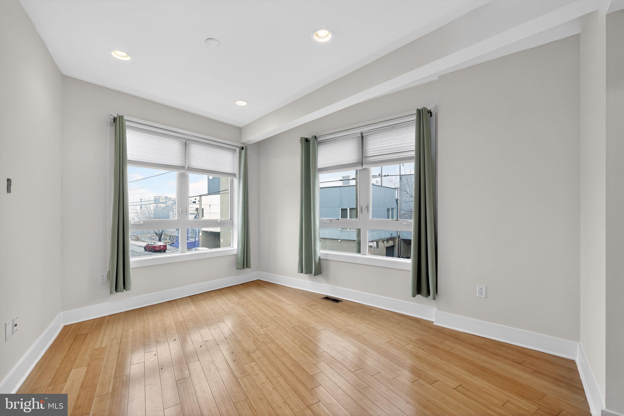 920 North Front Street Philadelphia, PA 19123 - Photo 13 of 28 a big room with wooden floor and windows