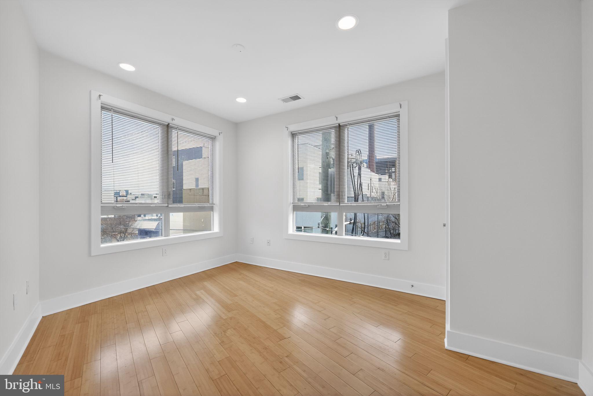 920 North Front Street Philadelphia, PA 19123 - Photo 14 of 28 a view of an empty room with a window and wooden floor