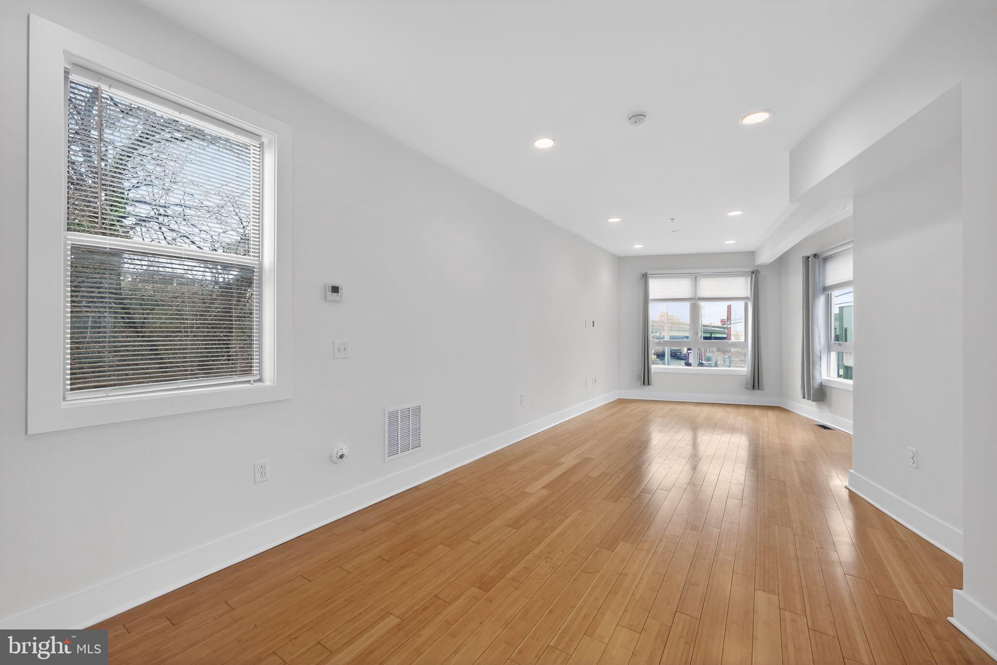 920 North Front Street Philadelphia, PA 19123 - Photo 17 of 28 a view of an empty room with wooden floor and a window