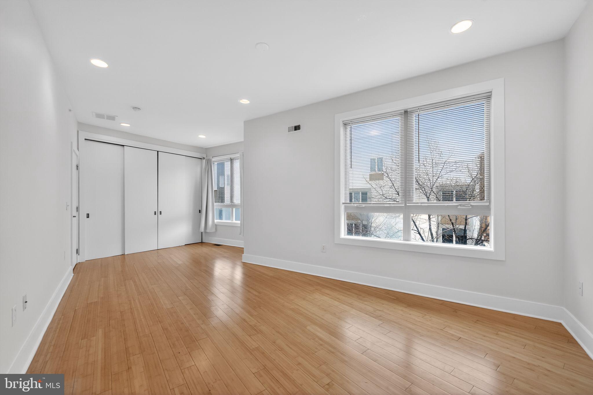 920 North Front Street Philadelphia, PA 19123 - Photo 23 of 28 a view of an empty room with wooden floor and a window