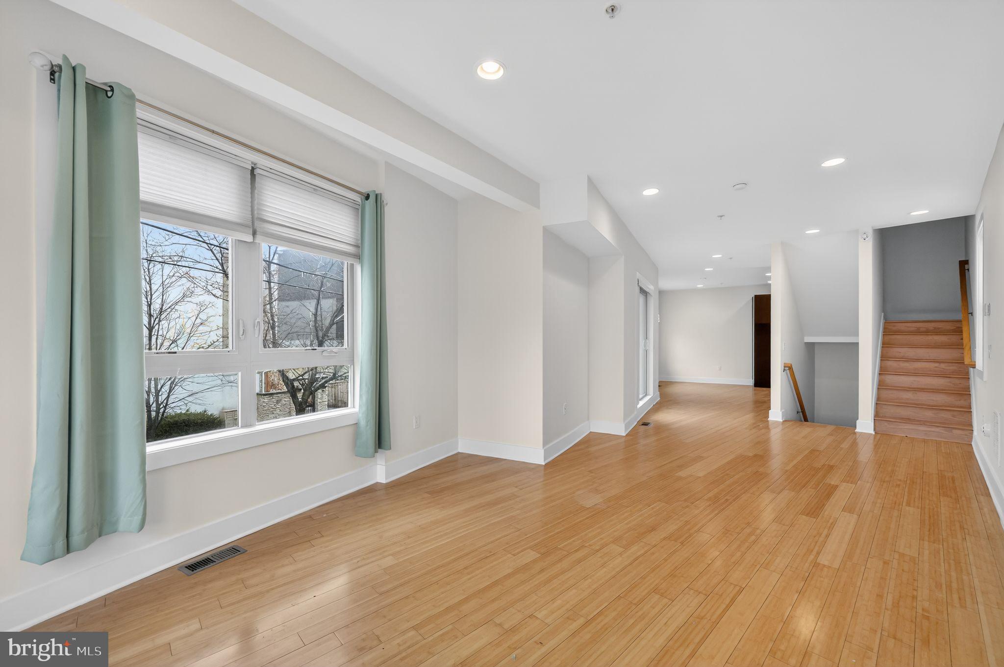 920 North Front Street Philadelphia, PA 19123 - Photo 6 of 28 a view of empty room with wooden floor and fan