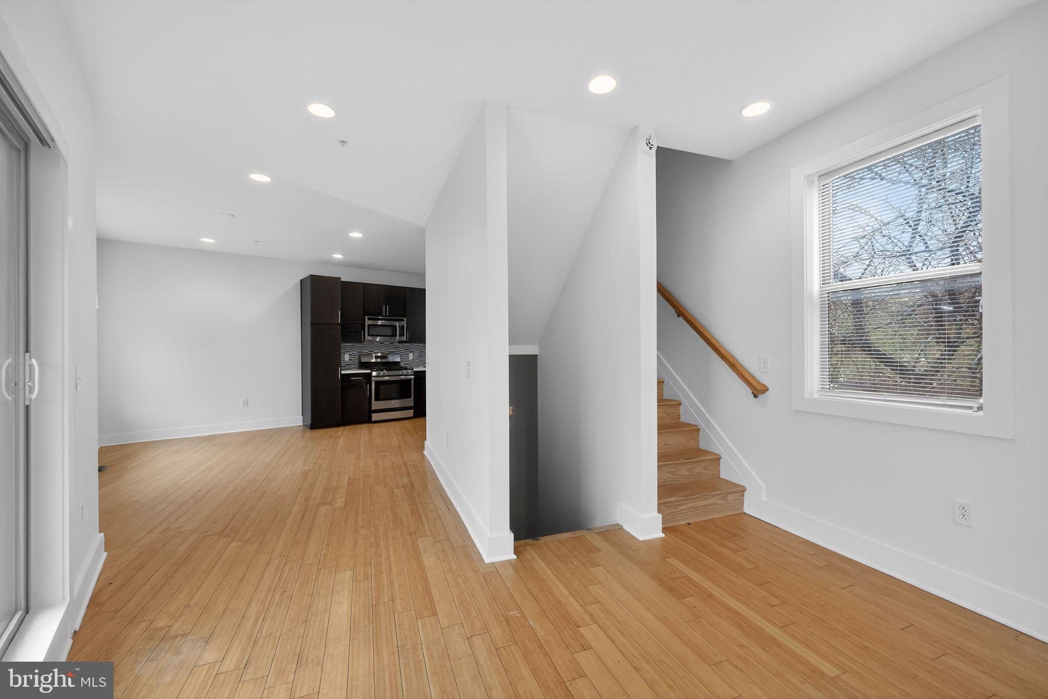 920 North Front Street Philadelphia, PA 19123 - Photo 7 of 28 a view of an empty room with wooden floor and a window