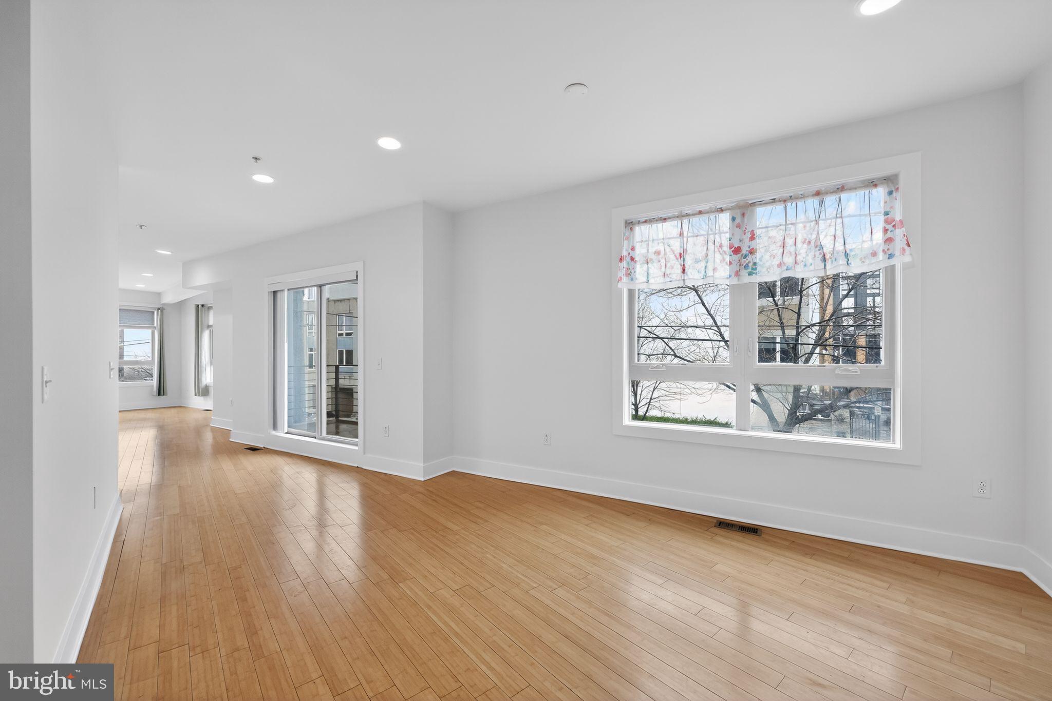 920 North Front Street Philadelphia, PA 19123 - Photo 9 of 28 a view of an empty room with wooden floor and a window