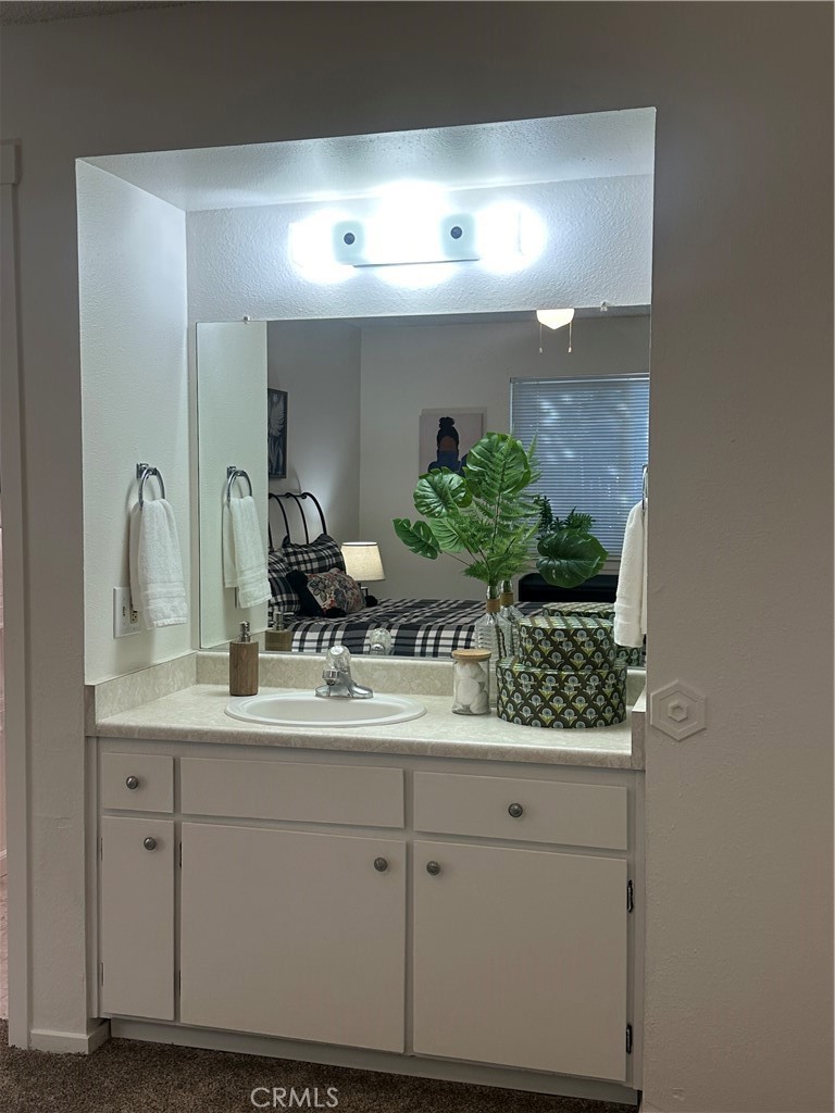 1412 North Cherry Street, Unit 9 Chico, CA 95926 - Photo 11 of 12 a bathroom with a sink and a mirror