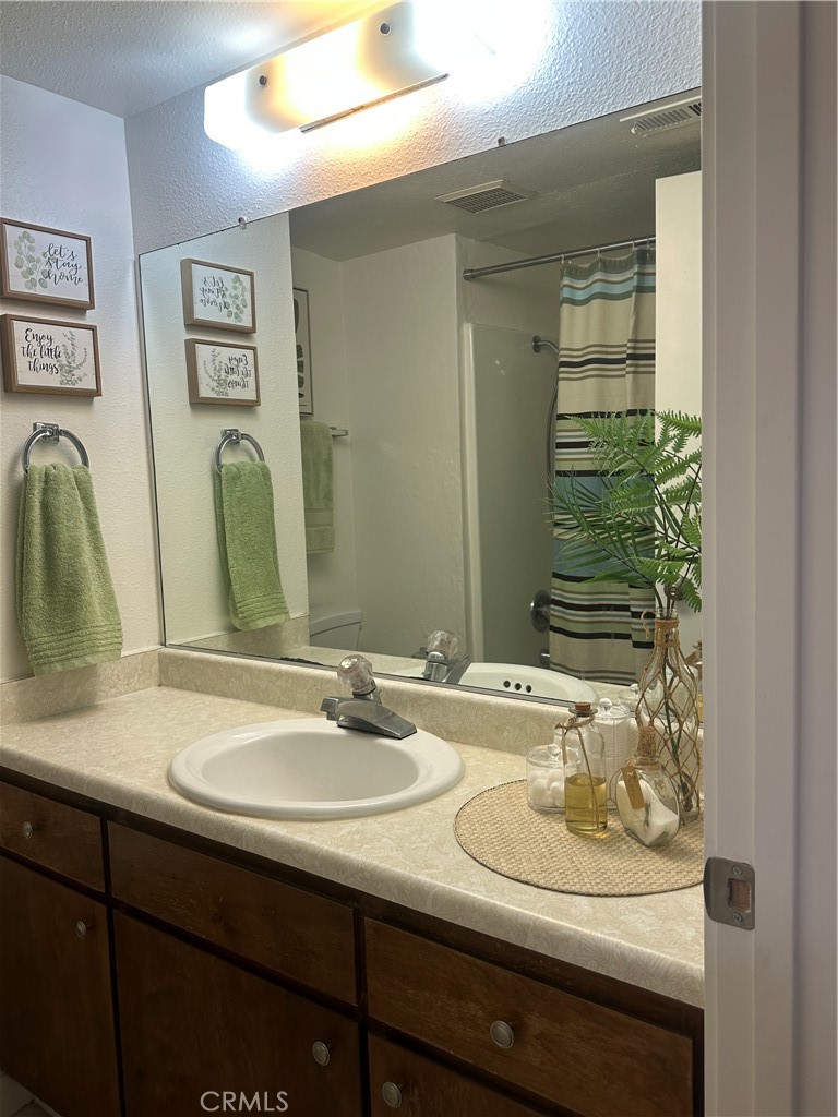 1412 North Cherry Street, Unit 9 Chico, CA 95926 - Photo 5 of 12 a bathroom with a sink and a mirror