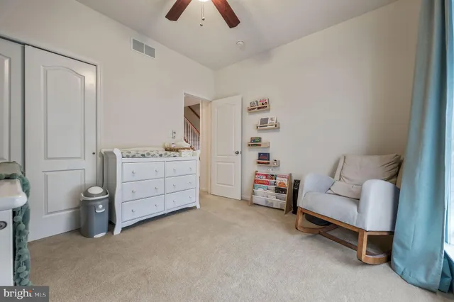 a bedroom with furniture and white walls