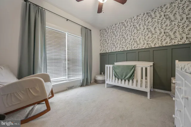 a bedroom with furniture and a window