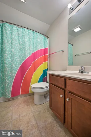 a bathroom with a sink a toilet and tub