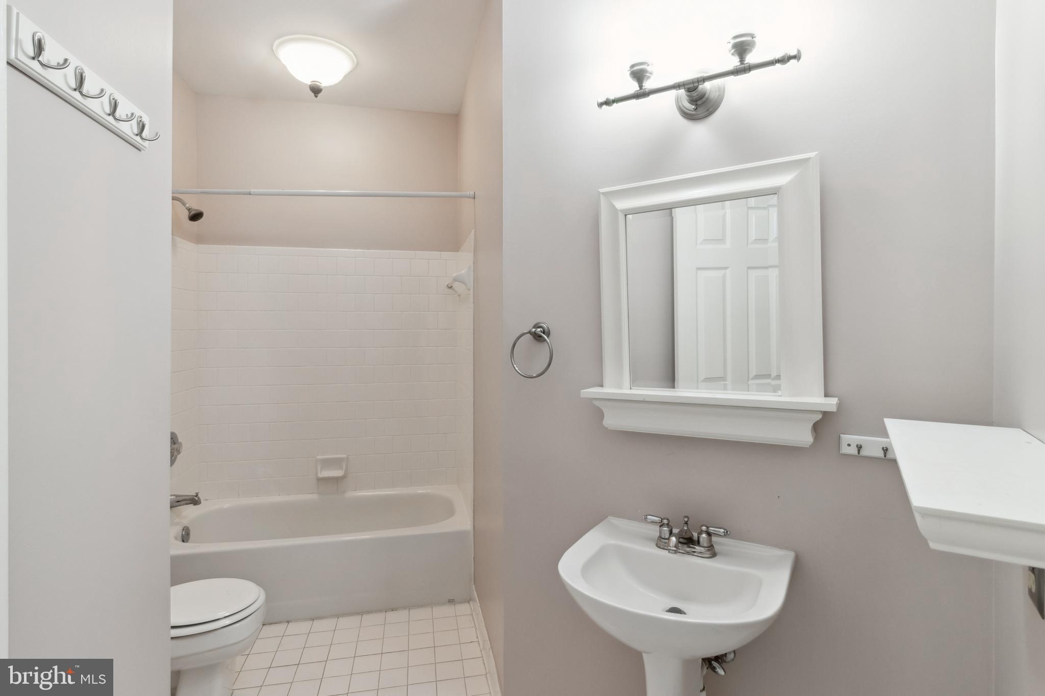 524 Kinsale Road Lutherville-Timonium, MD 21093 - Photo 14 of 22 a bathroom with a sink toilet and shower