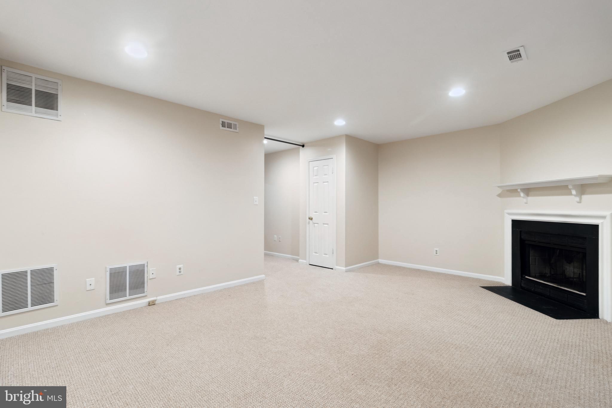524 Kinsale Road Lutherville-Timonium, MD 21093 - Photo 18 of 22 a view of an empty room with a fireplace
