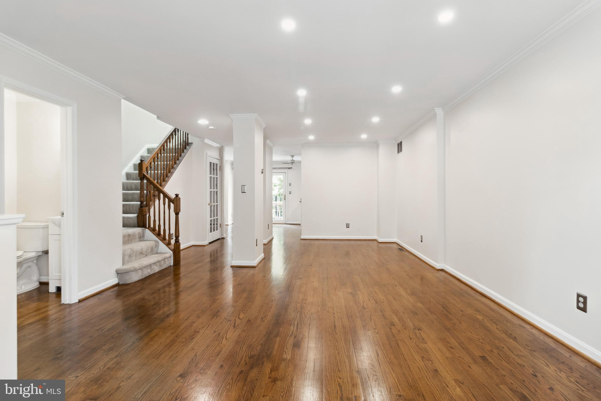 524 Kinsale Road Lutherville-Timonium, MD 21093 - Photo 4 of 22 a view of empty room with wooden floor and stairs