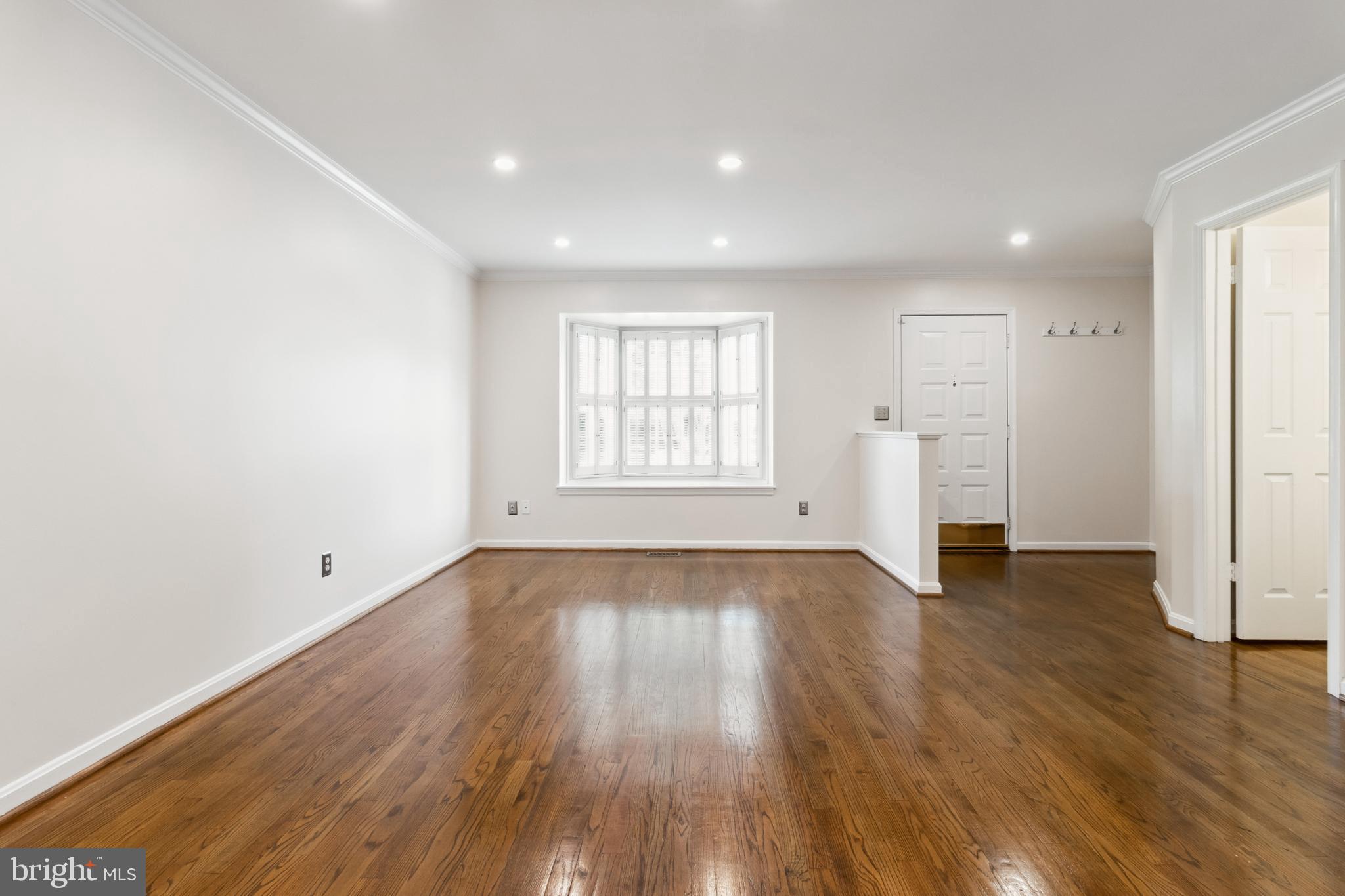 524 Kinsale Road Lutherville-Timonium, MD 21093 - Photo 5 of 22 an empty room with wooden floor and windows