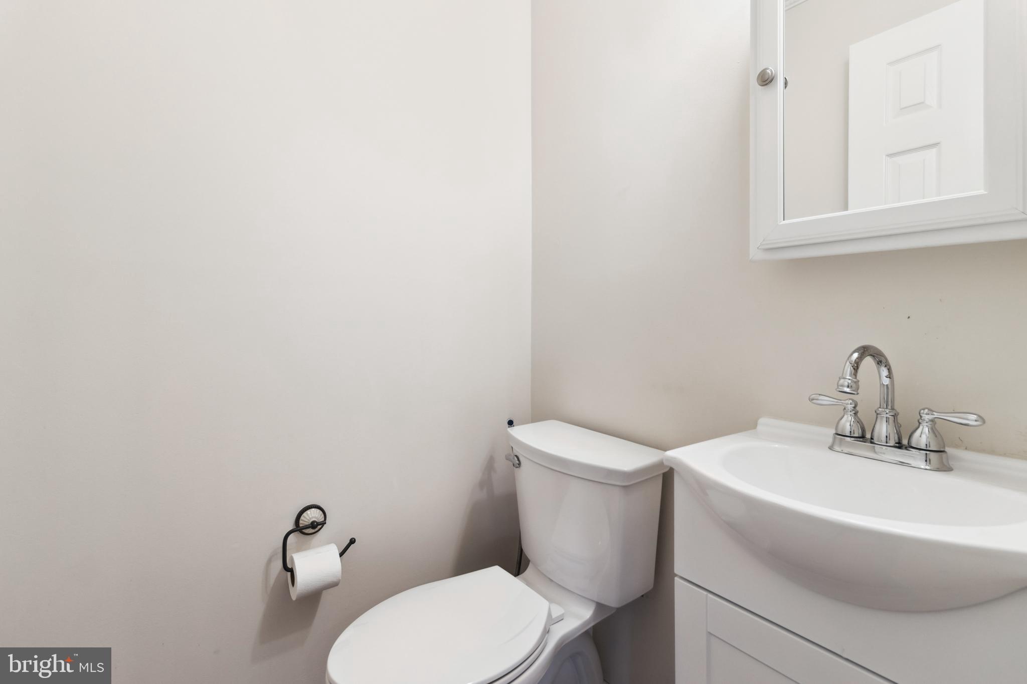 524 Kinsale Road Lutherville-Timonium, MD 21093 - Photo 7 of 22 a white toilet sitting next to a bathroom sink