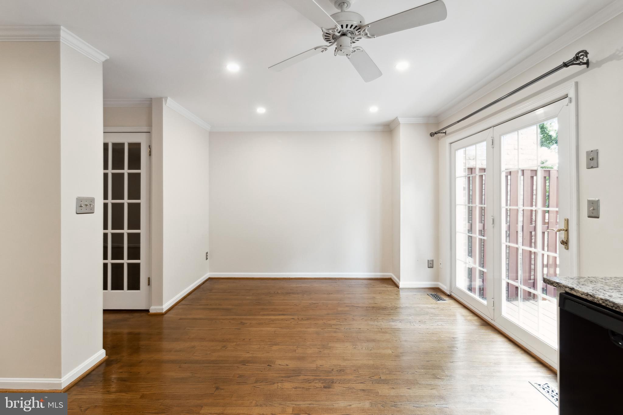524 Kinsale Road Lutherville-Timonium, MD 21093 - Photo 10 of 22 wooden floor in an empty room with a window