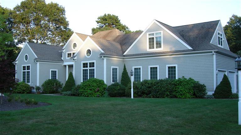 166 Cairn Ridge Road East Falmouth, MA 02536 - Photo 1 of 25 a front view of a house with a garden