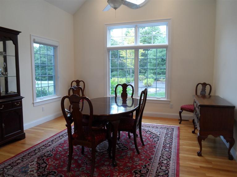 166 Cairn Ridge Road East Falmouth, MA 02536 - Photo 11 of 25 a view of a dining room with furniture window and outside view