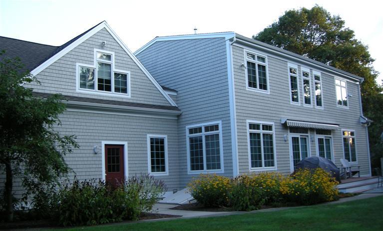 166 Cairn Ridge Road East Falmouth, MA 02536 - Photo 25 of 25 a front view of a house with a yard and trees