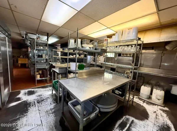 a stove top oven sitting inside of a kitchen