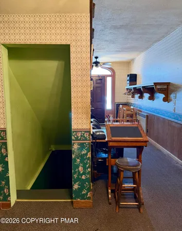 a kitchen with a table and chairs