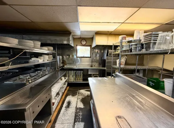 a kitchen with a stove and a microwave