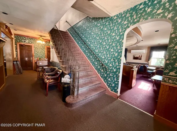 a view of a living room and dining room