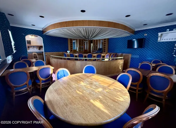 a view of kitchen with wooden cabinets