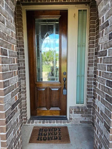 a view of a door and a window