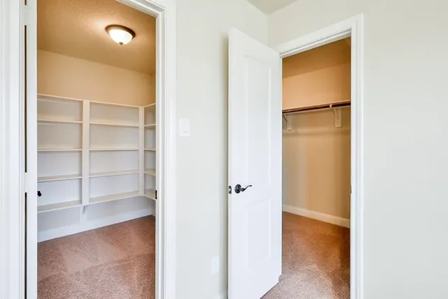 a view of a hallway with closet