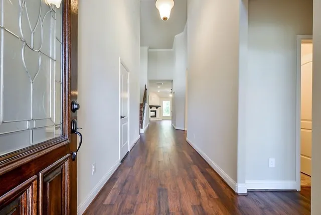 a view of hallway with wooden floor
