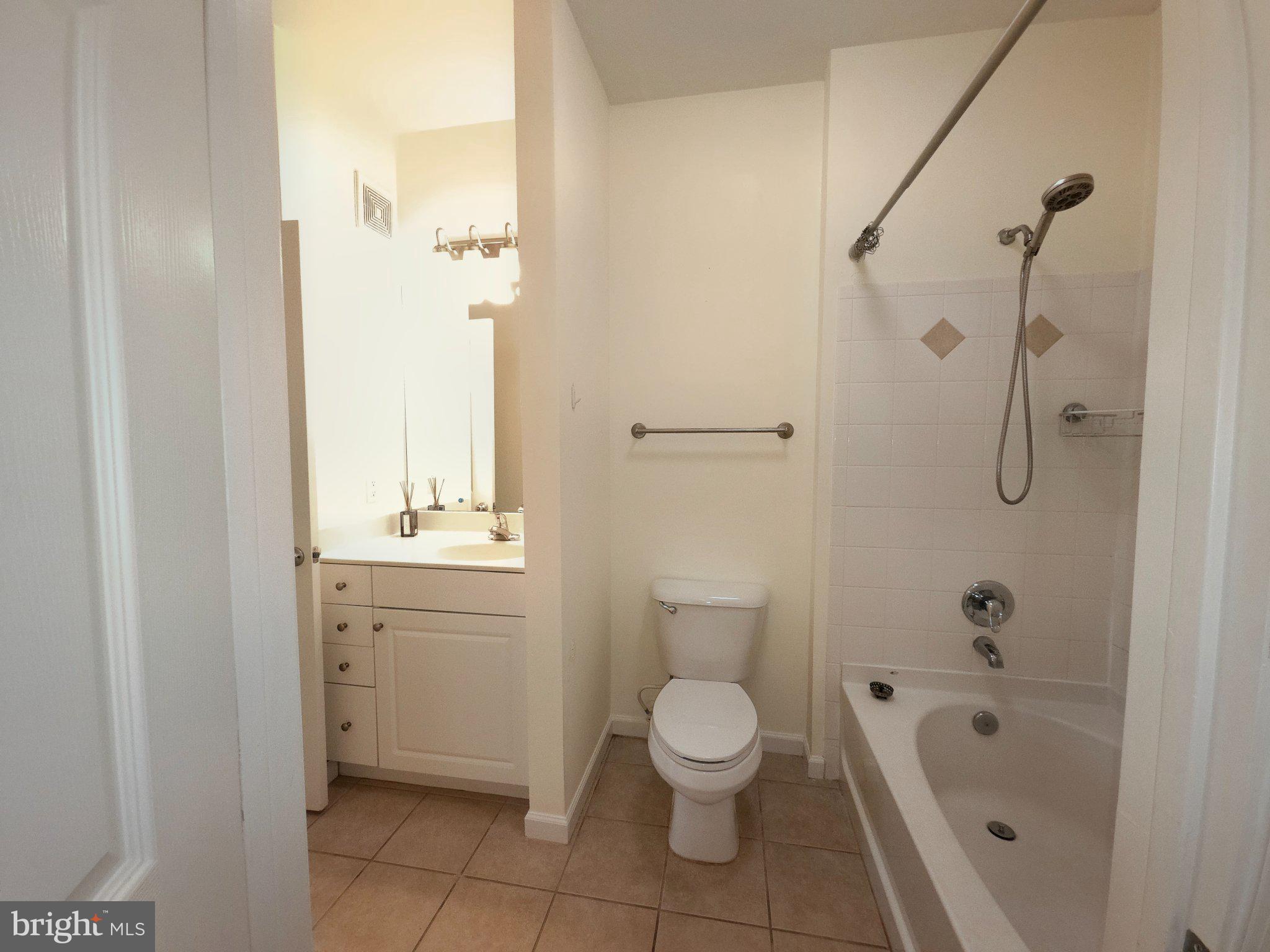7 Booth Street, Unit 308 Gaithersburg, MD 20878 - Photo 8 of 21 a bathroom with a toilet sink and shower