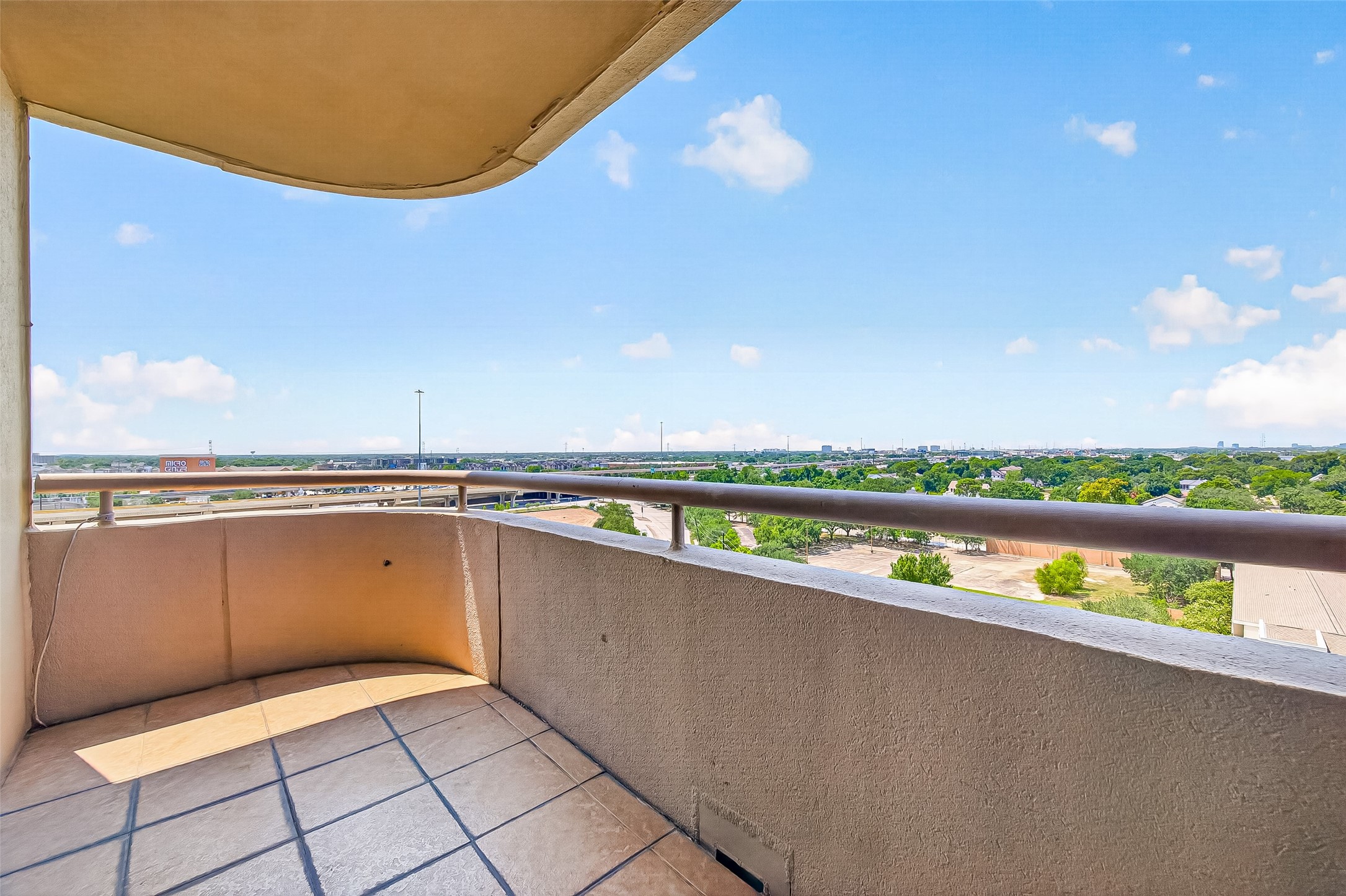3525 Sage Road, Unit 1116 Houston, TX 77056 - Photo 24 of 25 Covered balcony provides outdoor space and wide-open city views.