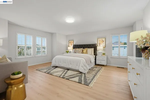 a bedroom with a bed and a cabinets