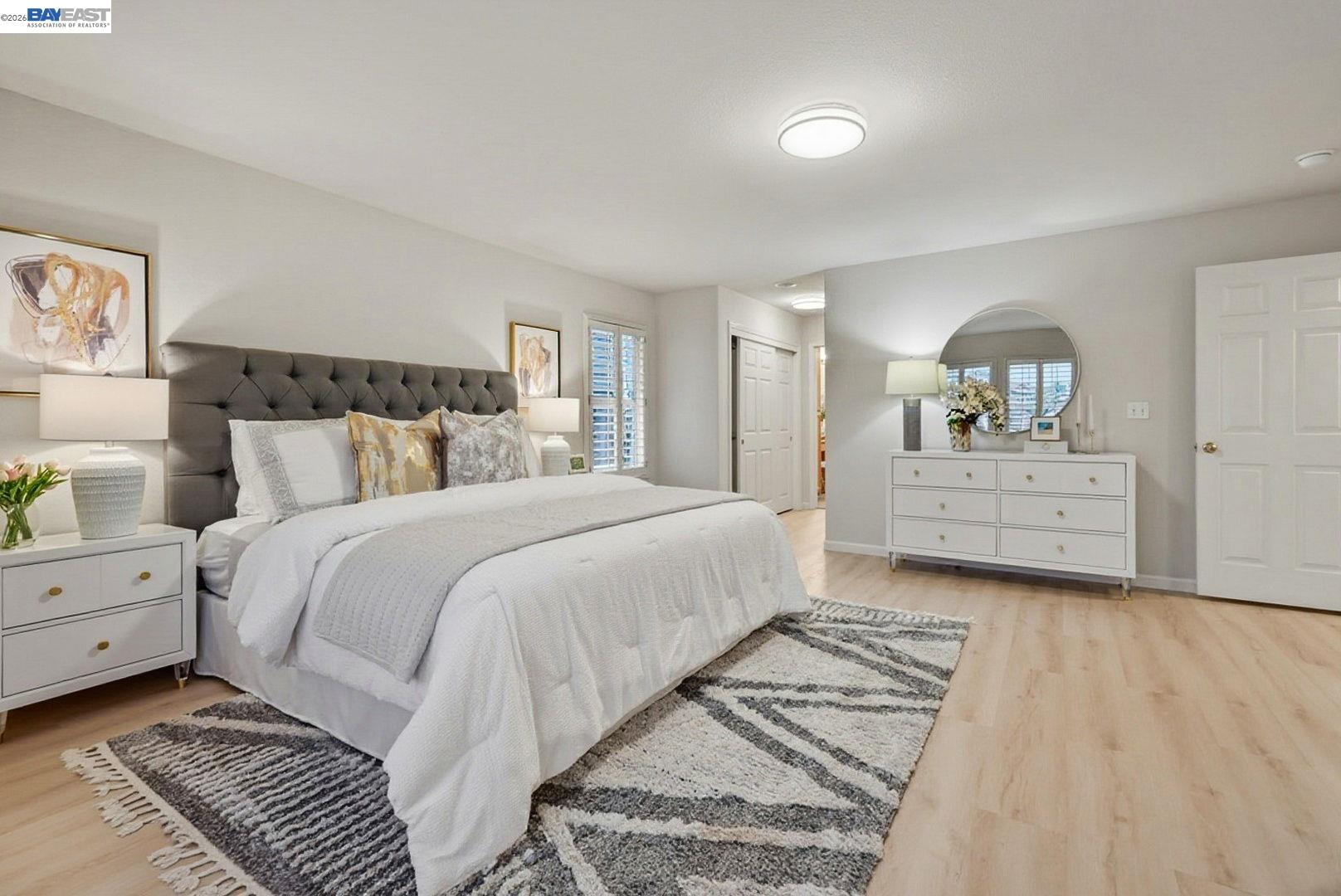 663 Clay Way Ripon, CA 95366 - Photo 20 of 43 a spacious bedroom with a bed and a window