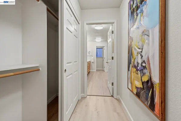 a view of an entryway with wooden floor