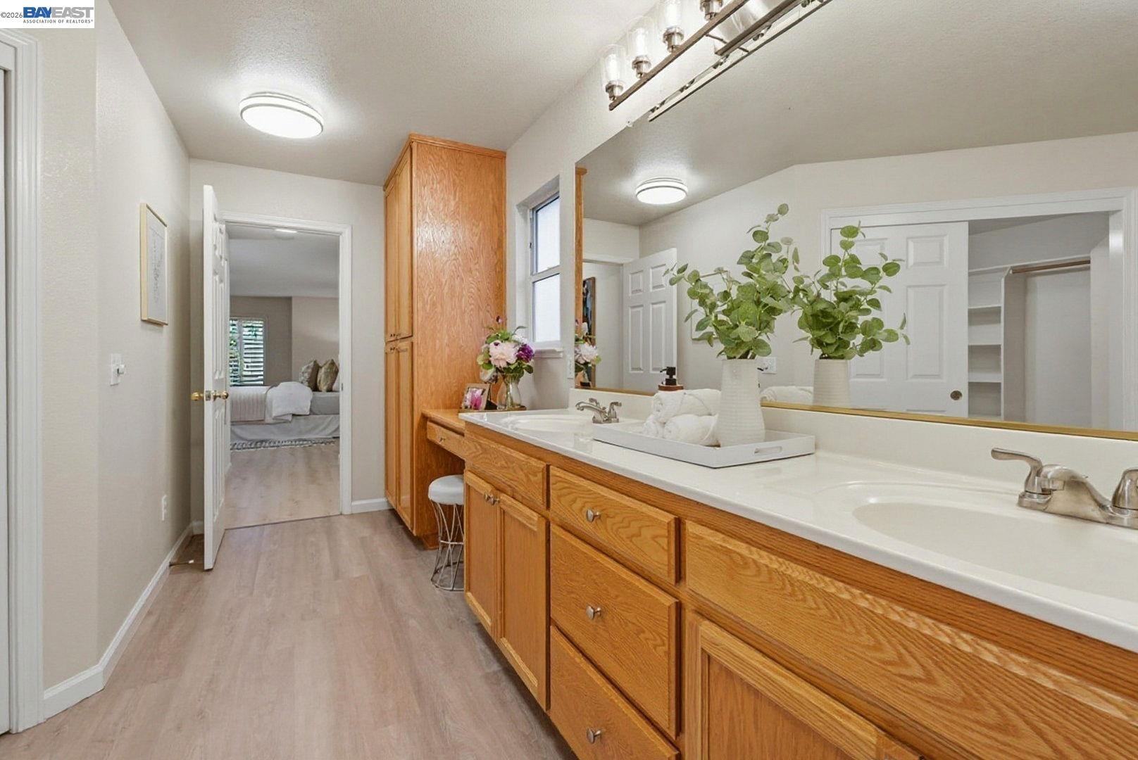 663 Clay Way Ripon, CA 95366 - Photo 24 of 43 a spacious bathroom with a double vanity sink and a mirror