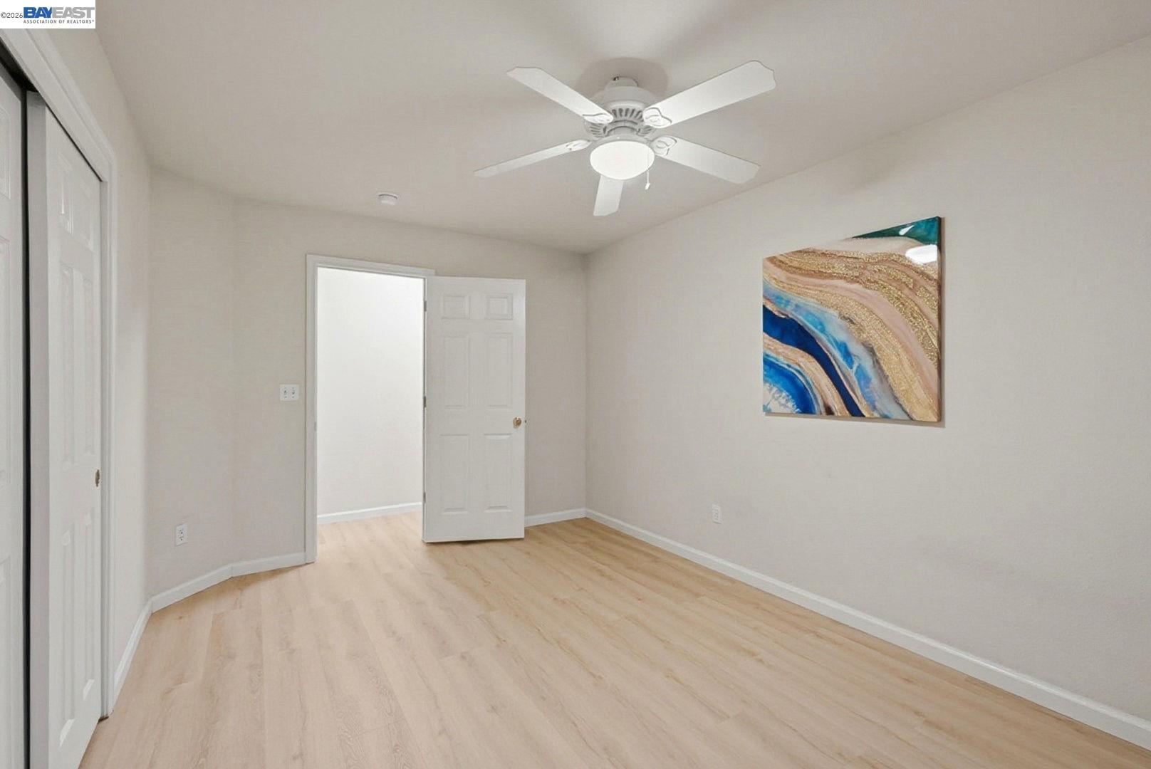 663 Clay Way Ripon, CA 95366 - Photo 28 of 43 a view of an empty room with wooden floor