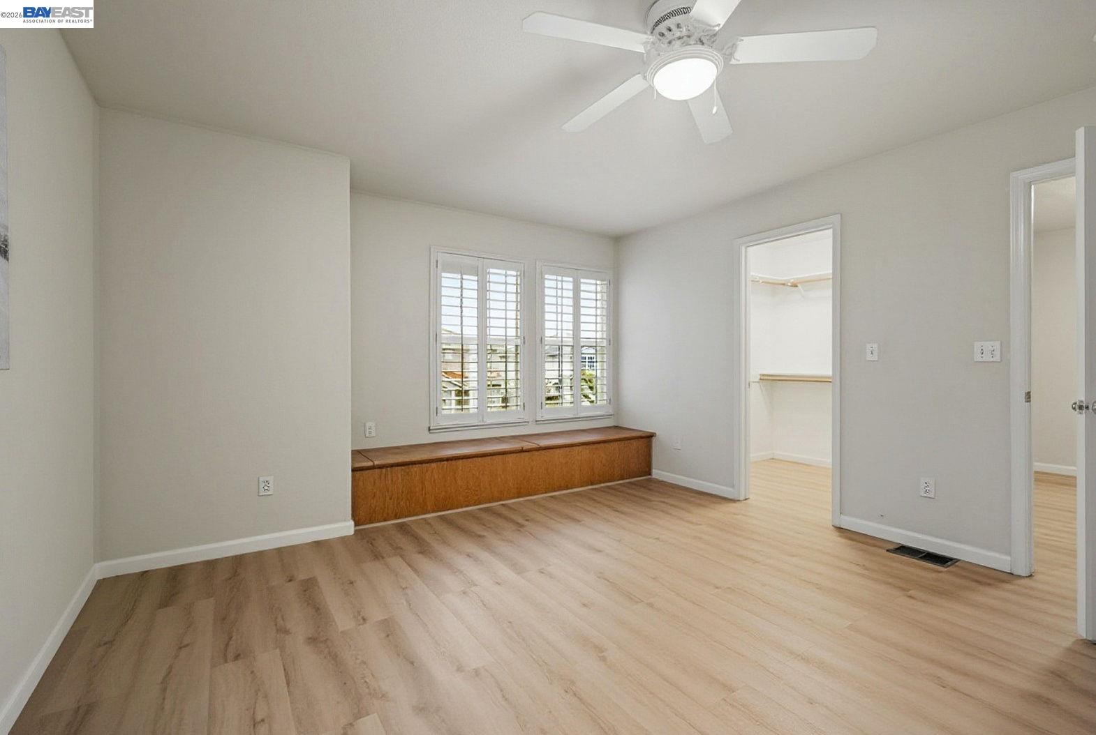 663 Clay Way Ripon, CA 95366 - Photo 35 of 43 an empty room with wooden floor and windows