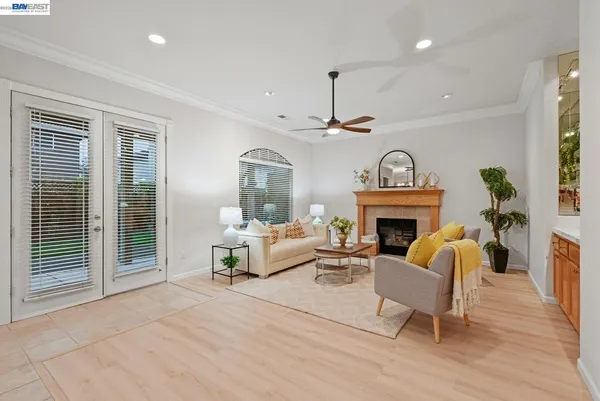 a living room with furniture and a fireplace