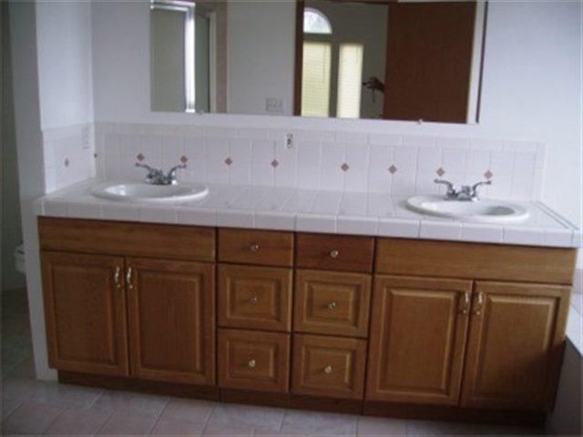 4051 Reeves Road Sunnyside, WA 98944 - Photo 7 of 9 a bathroom with a sink vanity and mirror