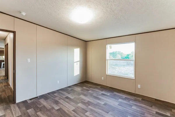 a view of hallway with wooden floor