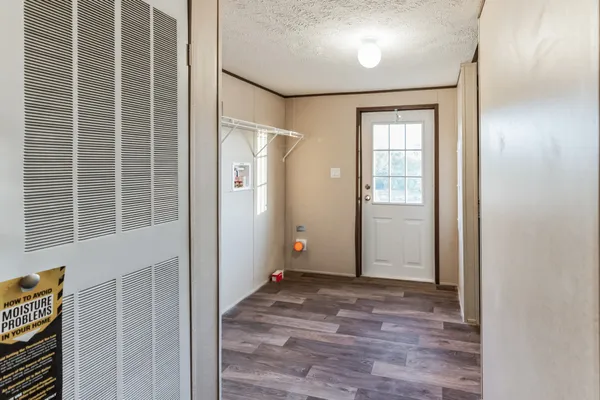 a bathroom with a sink and glass door