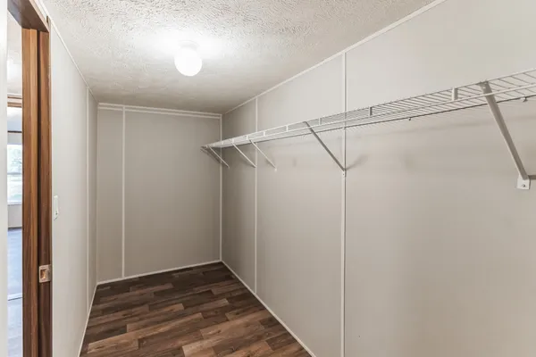 a view of hallway with wooden floor